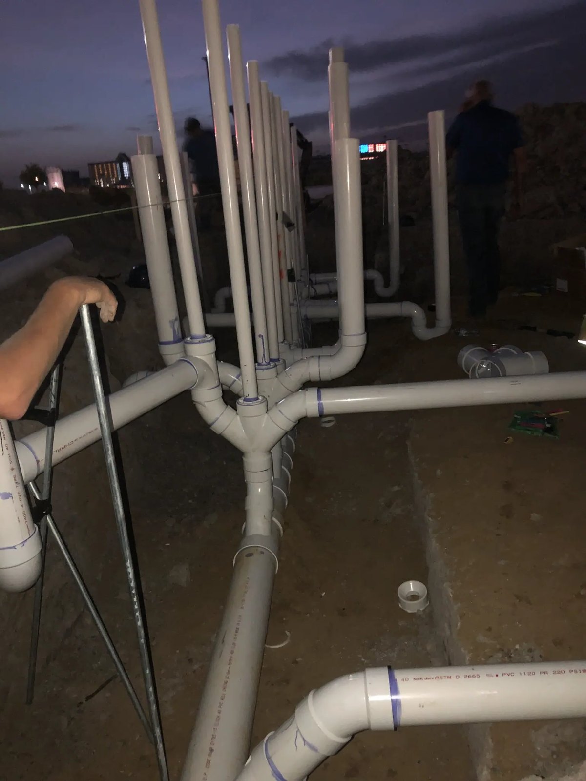 Commercial underground drain, waste, and vent rough-in before the slab pour