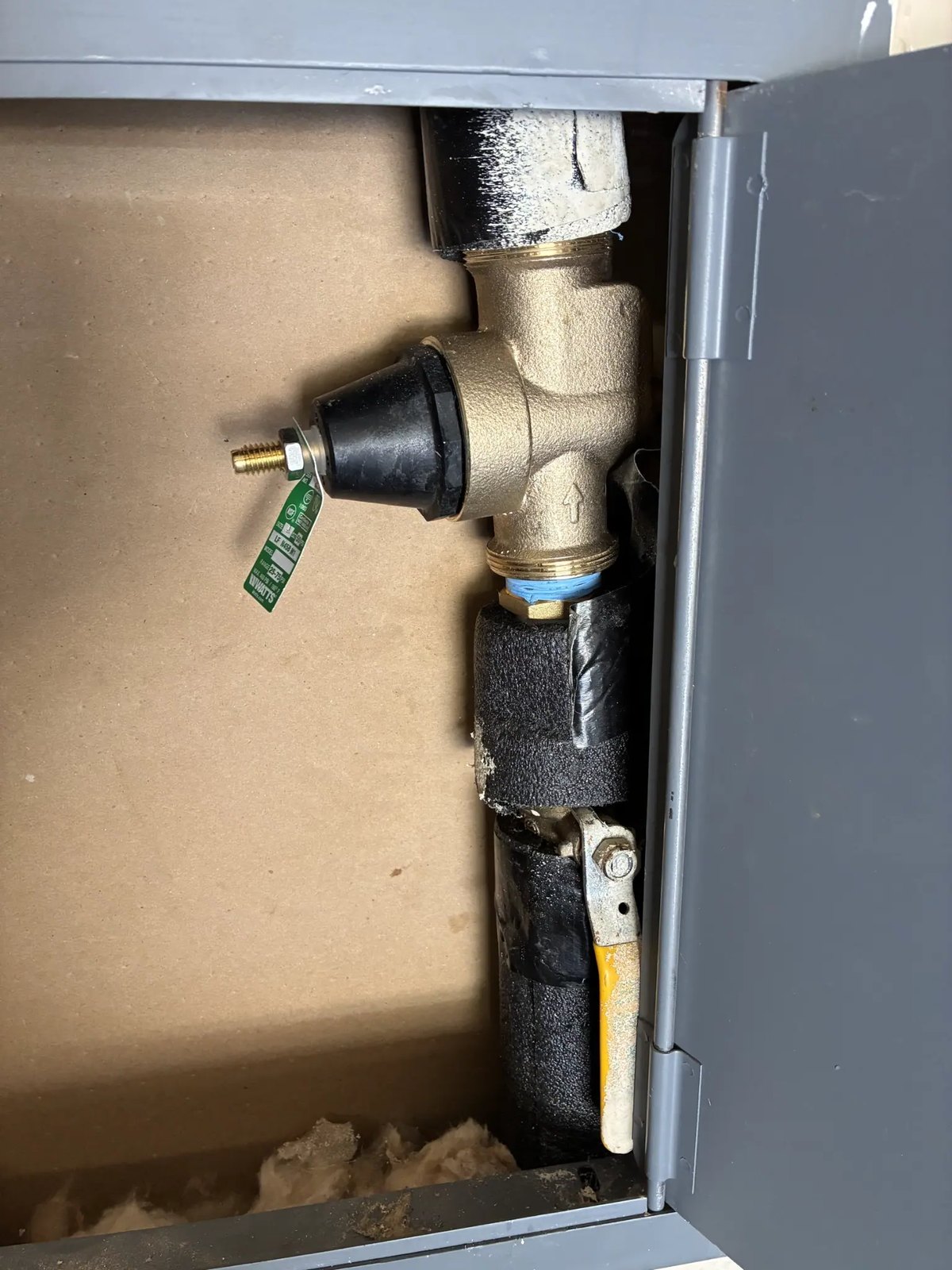 New pressure reducing valve installed in a wall box on a home's main water line
