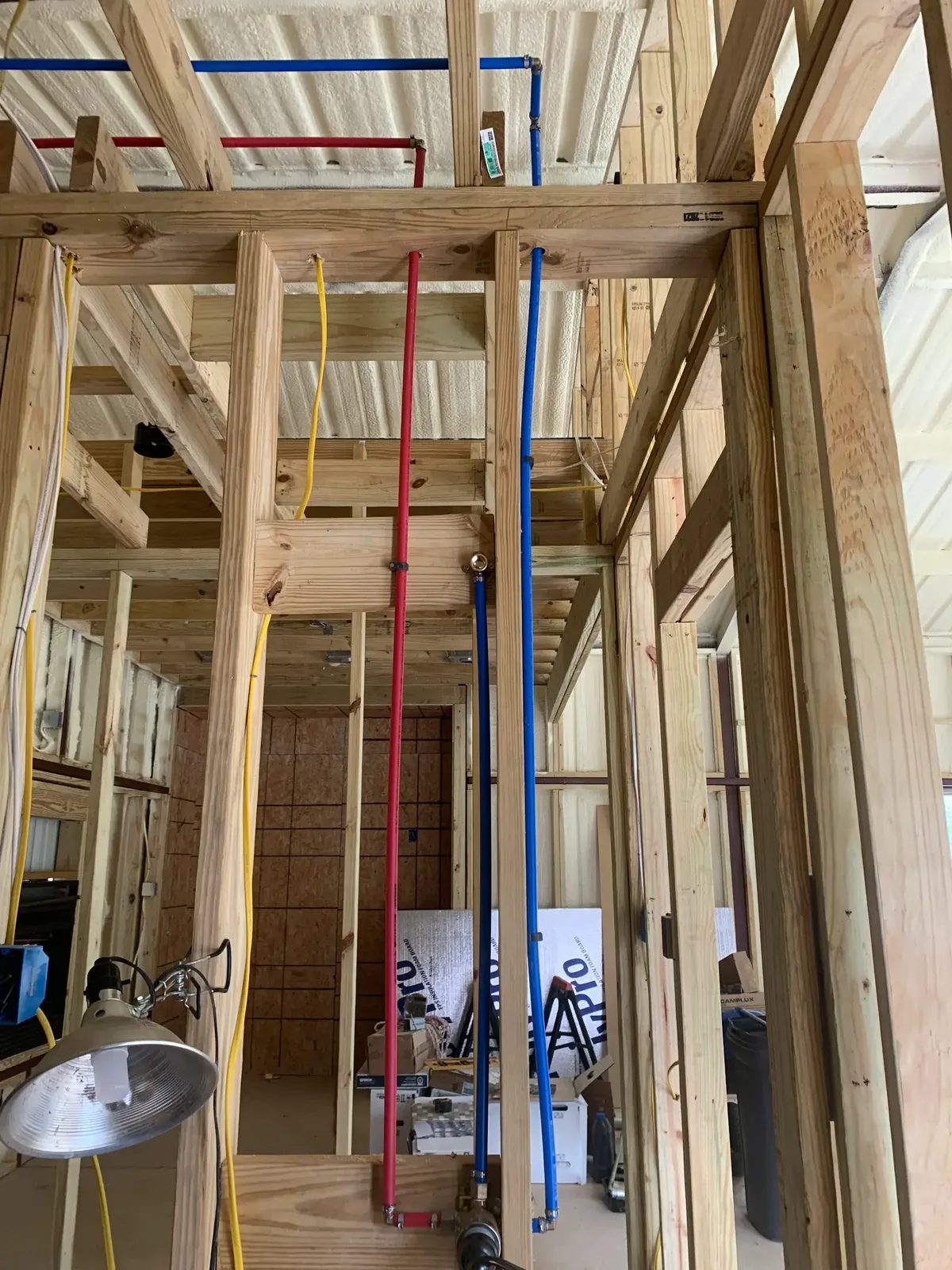 Exposed hot and cold water-supply lines during plumbing work